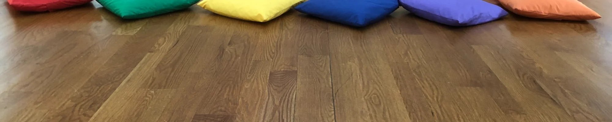 Pillows on a new hardwood floor installed in Bellmawr